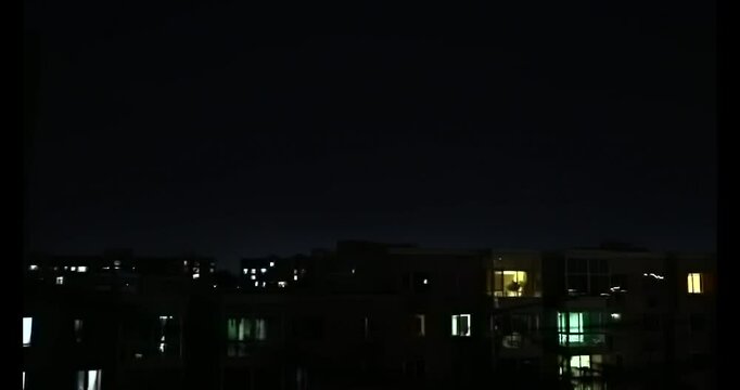 A distant lightning at night in the middle of City, Neighbourhood during the Storm