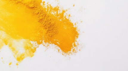 Obraz premium A vibrant yellow powder scattered on a white surface, suggesting use in cooking or art.