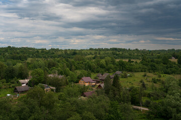 Fototapeta premium View of the Izborsko-Malskaya Valley and the village of Izborsk on a sunny summer day, Pechersk district, Pskov region, Russia