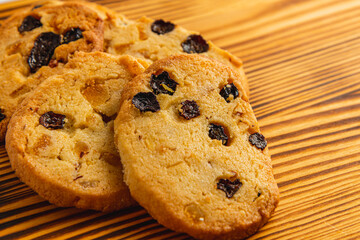 Festive homemade cookies with raisins on a wooden table