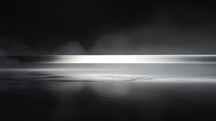 Serene Black and White Landscape with Calm Water and Misty Horizon