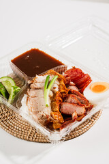 Red BBQ pork and crispy pork on rice,Food concept.Street food in thailand