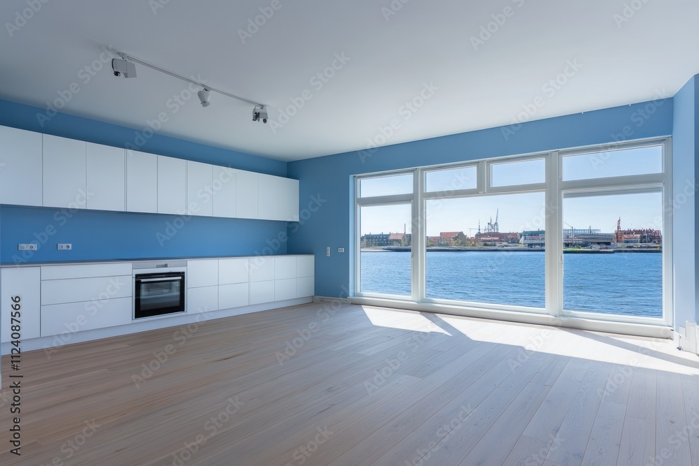 Poster modern empty room with a kitchen and large windows overlooking a waterfront view.