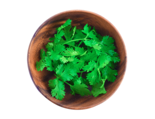 Top view of fresh coriander leaves in wooden bowl on transparent png
