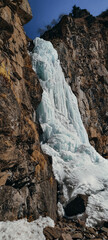 beautiful frozen waterfall in the mountains