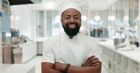 Happy, black man and portrait with chef at bakery for culinary art, hospitality or skill at indoor restaurant. African, male person or cook with smile or arms crossed in confidence at store or shop