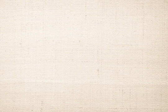 Brown sackcloth woven texture background in natural pattern. Jute hessian burlap, linen background in light beige cream color blank. Weaving canvas fiber line cotton cloth textured as organic.