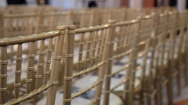 Elegant and stylish Chiavari chairs are meticulously arranged to enhance the sophisticated ambiance of the event