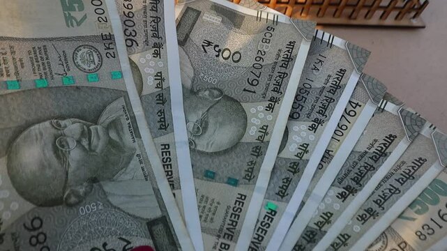 Indian 500 rupee note representing Indian currency concepts like tax, loan, investment, banking, and financial planning.