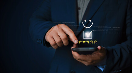 A businessman holding a calculator phone and key representing technology and communication concepts