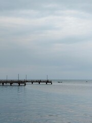 Peaceful Fishing Pier at Dusk Coastal Waters Landscape Tranquil Environment Wide-Angle Serenity Concept