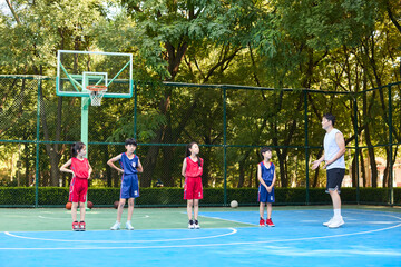 Chinese Kids Warming Up During Basketball Training Class