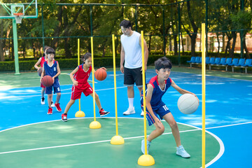 Chinese Kids Warming Up During Basketball Training Class