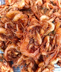 Small river prawns coated in crispy batter, a delicious Thai delicacy.