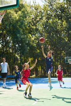Chinese Kids Playing Basketball on Basketball Court