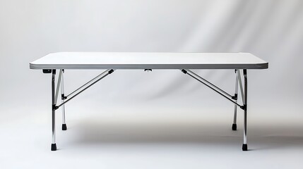 A white folding table with metal legs