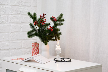 Cozy Holiday Decor featuring Pine and Berries , notebooks and glasses for Capturing the True Winter Vibes