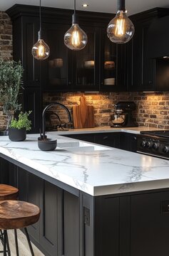 Modern, stylish kitchen with dark cabinets, marble countertop, and pendant lights.