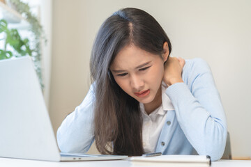 Body muscles stiff problem, ache asian young woman, girl pain neck while sitting work on chair at home, holding massaging rubbing, hurt or sore, Healthcare people, office syndrome.