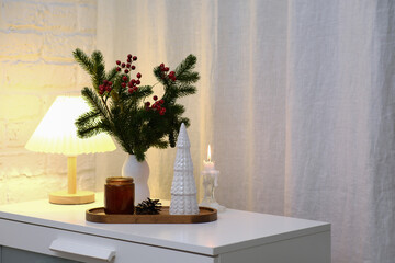 Cozy Holiday Decor featuring Pine and Berries , burning candle for Capturing the True Winter Vibes