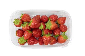 Ripe strawberries in an open plastic box. View from above. The box isolated on white background.