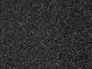 Seamless dark gray speckled texture, ideal for backgrounds or overlays.