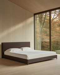 Minimalist bedroom with a bed and expansive window overlooking autumn foliage