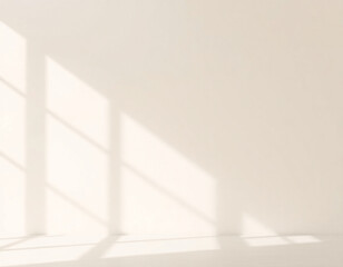 Sunlit room with clean white walls and soft shadows, ideal for minimalist interiors and modern design