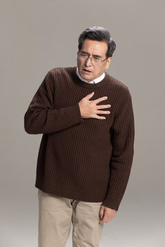 Senior Chinese man having a heart attack