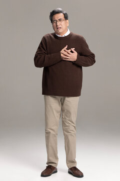 Senior Chinese man having a heart attack