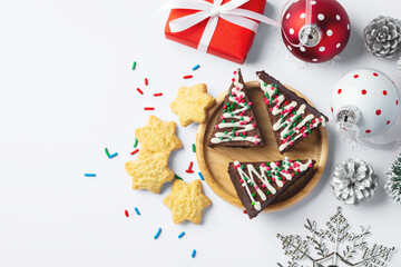 Christmas brownies and cookies with christmas decor on white background