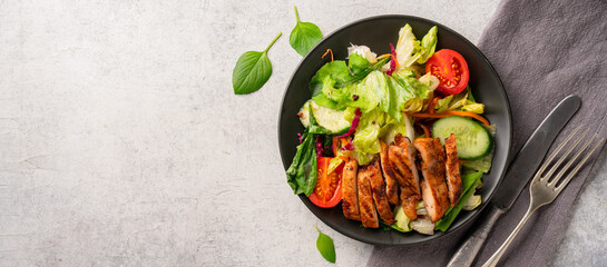 Salad and grilled chicken prepared for healthy nutrition