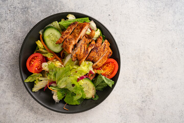Salad and grilled chicken prepared for healthy nutrition