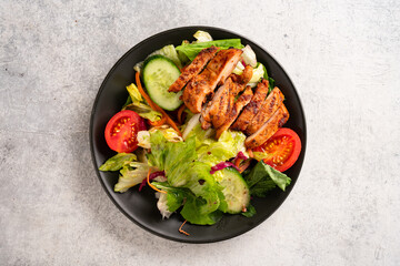 Salad and grilled chicken prepared for healthy nutrition