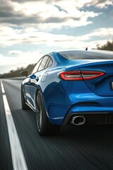 Blue car driving on the highway, motion blur, rear view. luxury sports sedan concept model