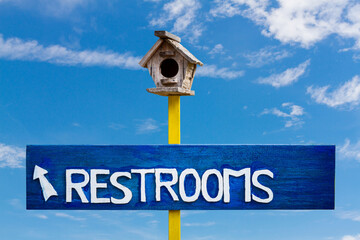 resteroom sign on blue sky background,Toilet sign on blue sky background