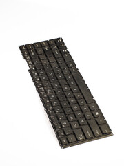 broken laptop keyboard that has been replaced by a new one, damage to the flexible cable view from top