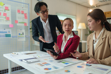 Team of business people working together in the office, analyzing, calculating and recording results. Financial budgets, investments, real estate project plans Business operations meeting concept.