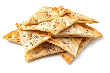 Fototapeta premium Pile of pita chips and small wheat tortillas on a white background Crunchy herbed spicy Mediterranean snack