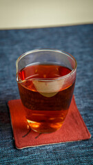 A warm mug of tea placed on a beautiful coaster, perfect for a calming afternoon vibe
