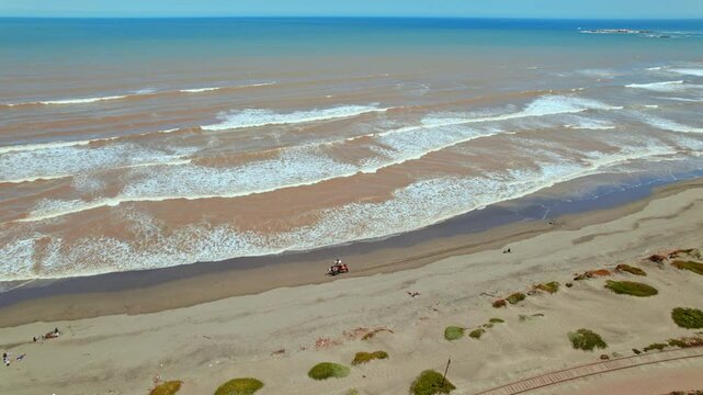 Aerial panoramic of Punta Piedra white sand, blue ocean Chilean beach in Ritoque