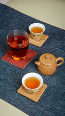 A beautifully arranged teapot and cups of brewed tea on an exquisite table enhance the experience