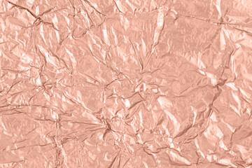 Fototapeta premium Background of crumpled mocha mousse color metal foil