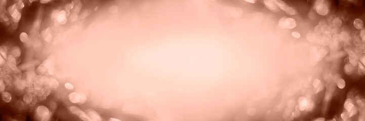 Blurred background Christmas tinsel in mocha mousse color