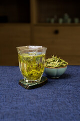 Enjoy the delightful taste of Freshly Brewed Green Tea with Herbal Leaves for an invigorating drink