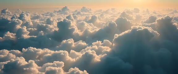 Majestic aerial view, fluffy cumulus clouds, golden sunlight, heavenly sky, panoramic cloudscape © Nafiz