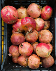 Ripe pomegranates in the street market.