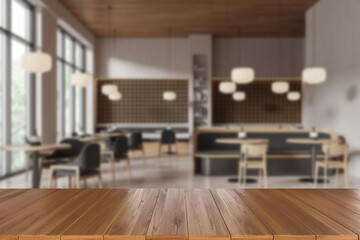 Wooden table surface with blurred modern cafe interior in the background. 3D Rendering