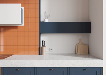 Modern kitchen design with orange tile backsplash, white countertop, and blue cabinets. 3D Rendering