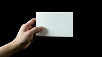 A Hand Holding a Blank Paper